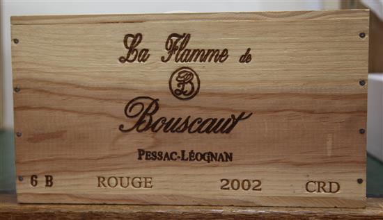 Six bottles of Chateau La Flamme de Bouscaut, 2002, in unopened original wooden box.